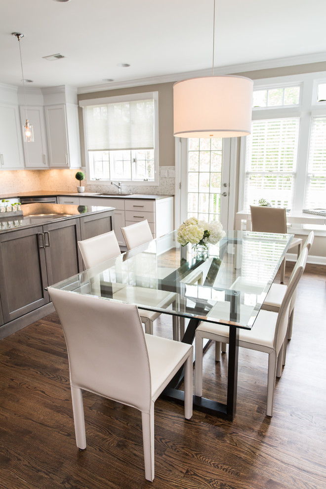 Inspiration for a large transitional u-shaped dark wood floor eat-in kitchen remodel in DC Metro with shaker cabinets, white cabinets, quartz countertops, beige backsplash, mosaic tile backsplash, stainless steel appliances, an island and an undermount sink