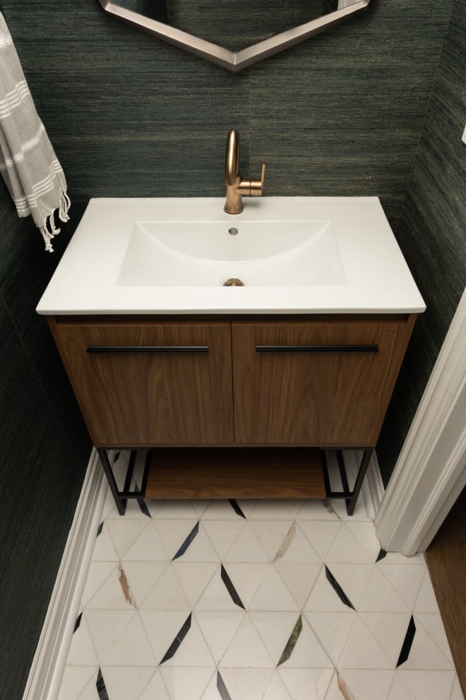 Photo of a small traditional cloakroom in Chicago with flat-panel cabinets, medium wood cabinets, green walls, an integrated sink, multi-coloured floors, white worktops and a freestanding vanity unit.