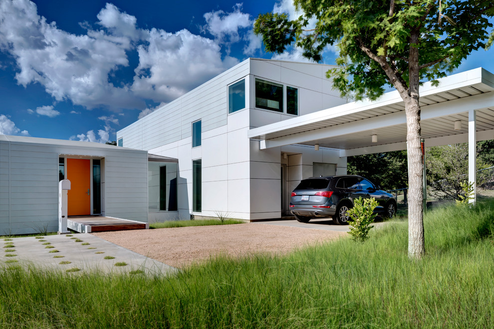 Design ideas for a modern exterior in Dallas with metal siding.