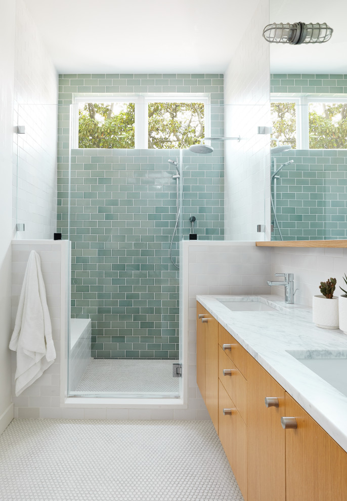 Photo of a large contemporary master bathroom in San Francisco with flat-panel cabinets, light wood cabinets, an alcove shower, ceramic tile, ceramic floors, an undermount sink, marble benchtops, a hinged shower door, a shower seat, a double vanity, a floating vanity, green tile, white walls, white floor and white benchtops.