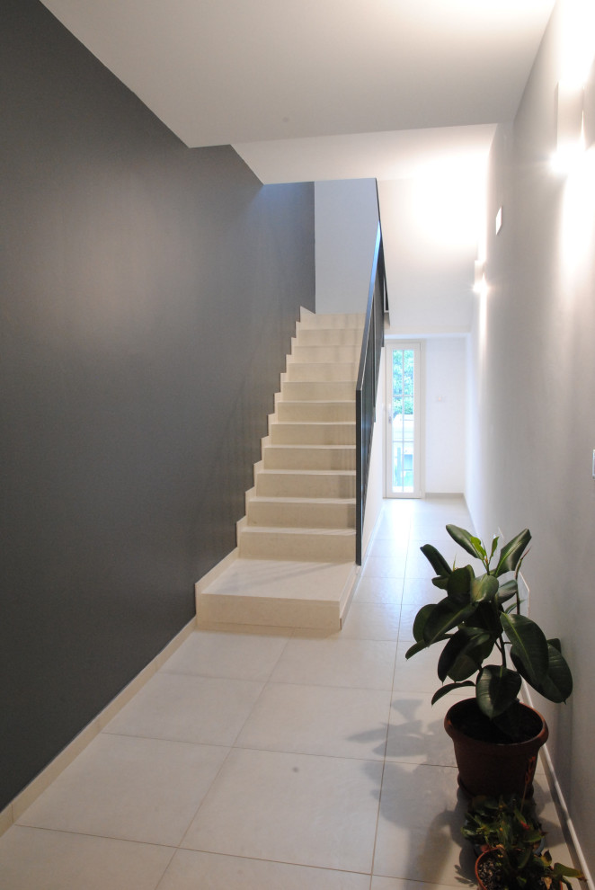 Photo of a contemporary staircase in Bologna with metal railing.