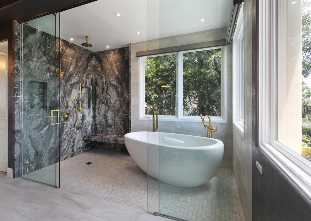 Design ideas for a mid-sized transitional master wet room bathroom in Orange County with shaker cabinets, white cabinets, a freestanding tub, black and white tile, marble, grey walls, engineered quartz benchtops, grey floor, a sliding shower screen and grey benchtops.
