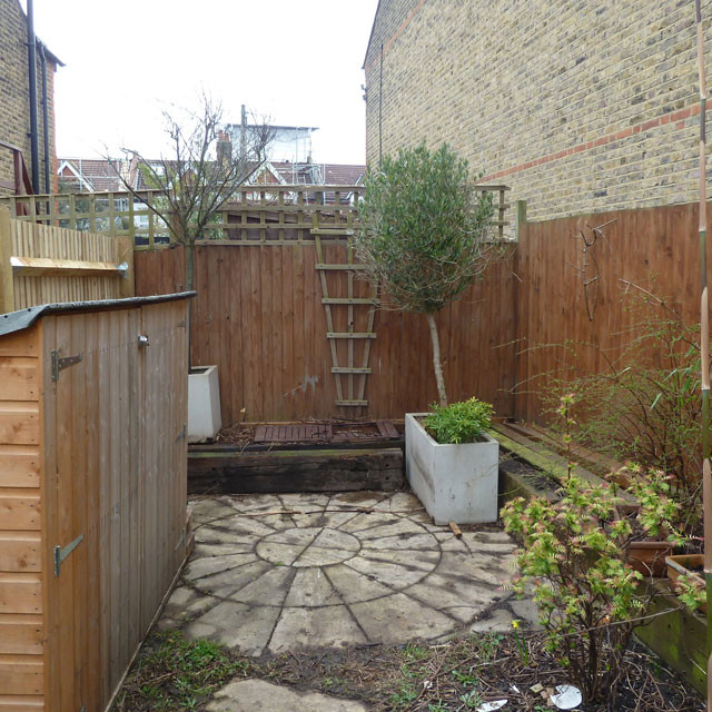 Design ideas for a small contemporary backyard garden in London with a water feature.