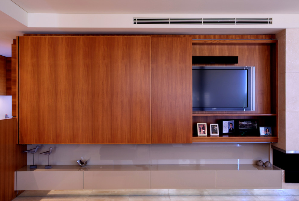 This is an example of a midcentury open concept living room in Perth with no fireplace and a built-in media wall.