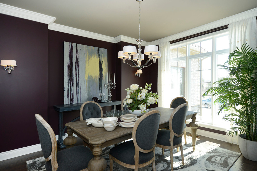 This is an example of a mid-sized transitional separate dining room in Other with purple walls, dark hardwood floors, no fireplace and brown floor.