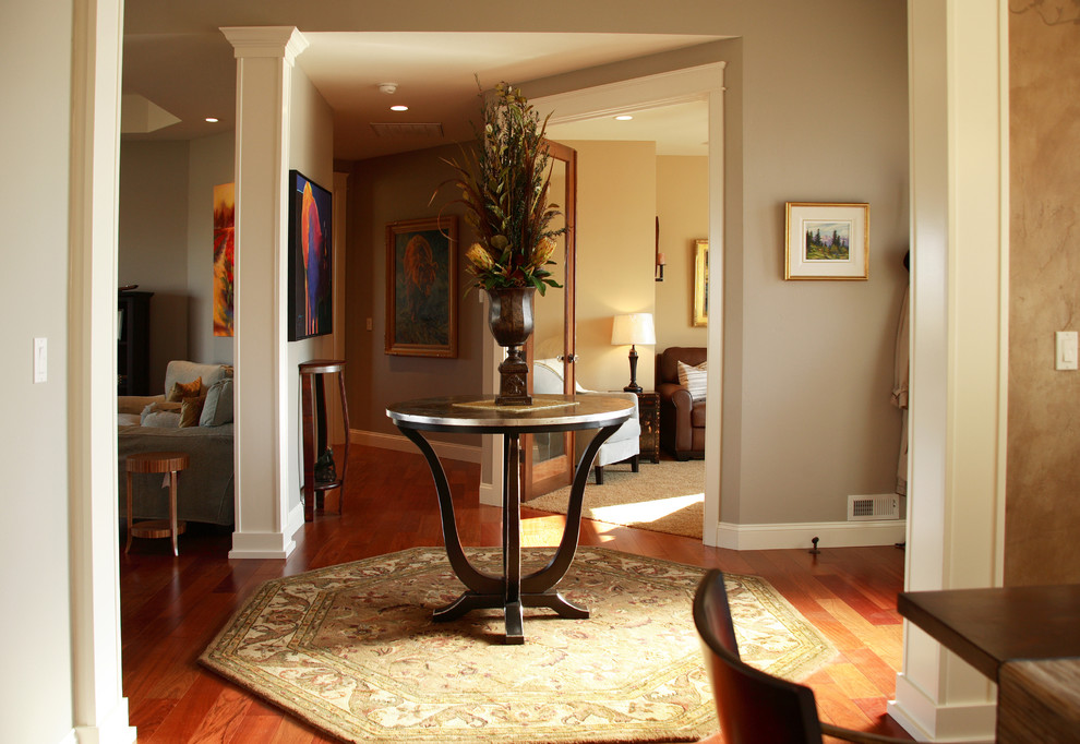 Mid-sized transitional dark wood floor and brown floor foyer photo in Seattle with gray walls and a dark wood front door