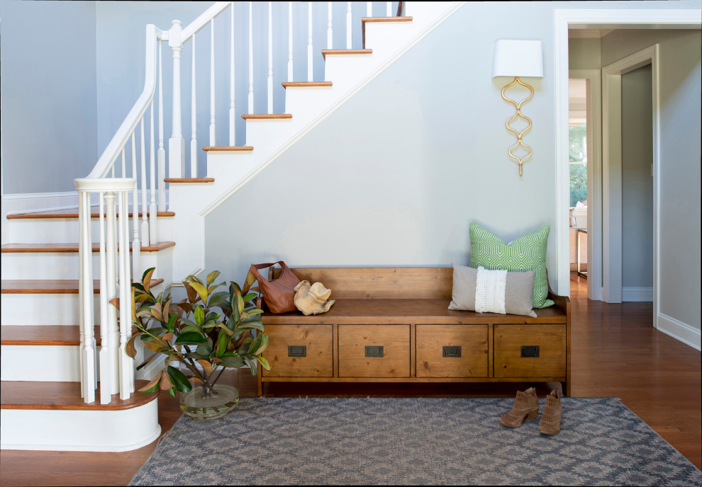Inspiration for a mid-sized transitional foyer in Raleigh with grey walls, medium hardwood floors and brown floor.