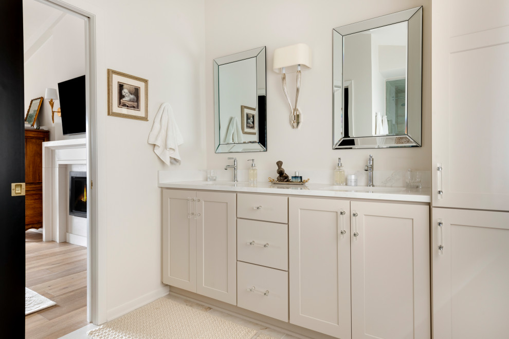 Inspiration for a mid-sized transitional multicolored tile and porcelain tile porcelain tile, multicolored floor, double-sink and vaulted ceiling alcove shower remodel in Minneapolis with shaker cabinets, beige cabinets, a bidet, white walls, an undermount sink, quartz countertops, a hinged shower door, white countertops and a built-in vanity