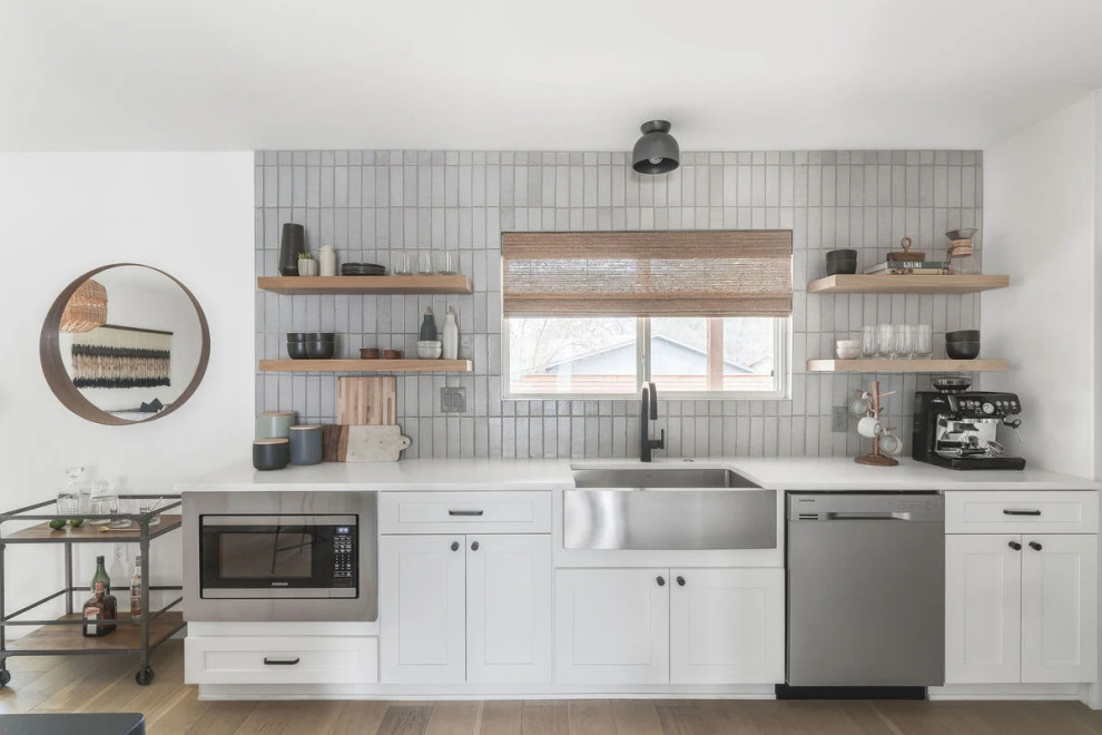 Design ideas for a modern kitchen in Austin with grey splashback and brick splashback.