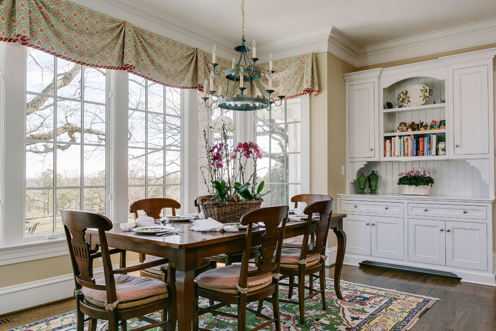 This is an example of a traditional kitchen/dining combo in Raleigh.