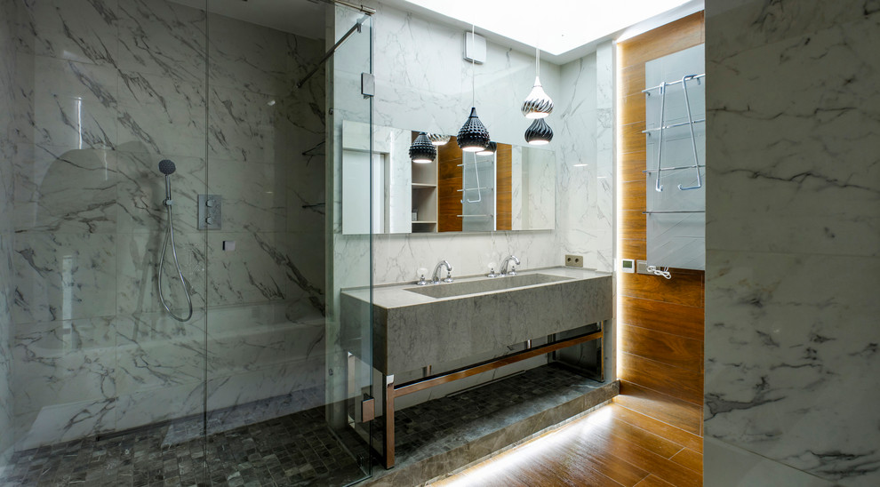 Mid-sized contemporary master bathroom in Other with flat-panel cabinets, an alcove tub, an alcove shower, a one-piece toilet, white tile, ceramic tile, brown walls, ceramic floors, a trough sink, brown floor and a hinged shower door.