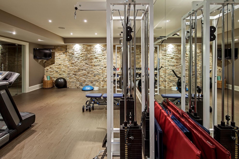 Inspiration for a transitional home gym in Toronto with brown walls and beige floor.