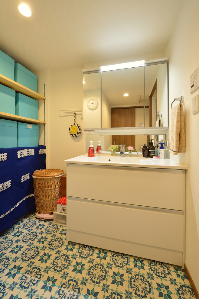 Beach style powder room in Other.