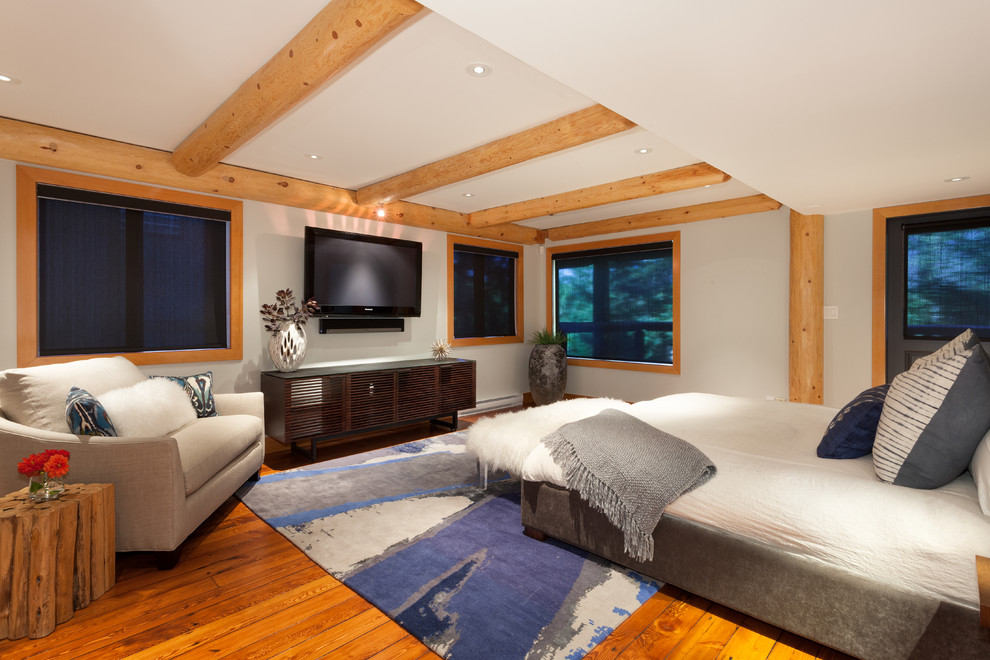 Inspiration for a large contemporary master bedroom in Vancouver with grey walls and light hardwood floors.