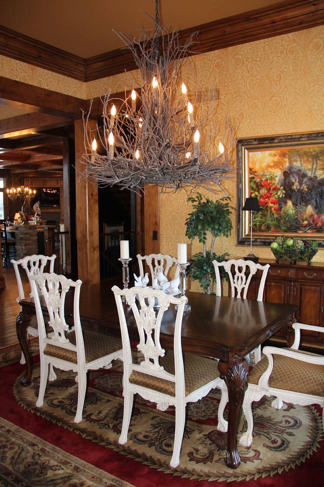 This is an example of an eclectic dining room in Cleveland.