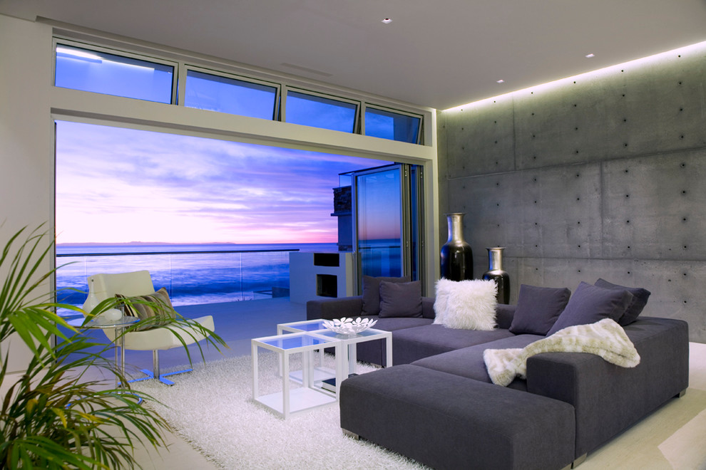 This is an example of a contemporary open concept living room in Orange County with no tv.