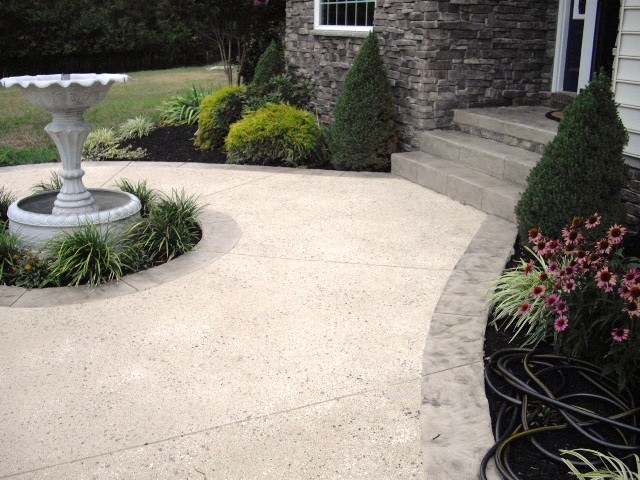 stamped concrete overlay / spray texture combo