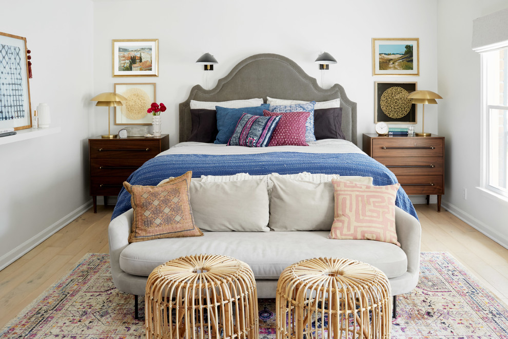 Inspiration for an eclectic guest bedroom in Nashville with white walls, light hardwood floors and beige floor.
