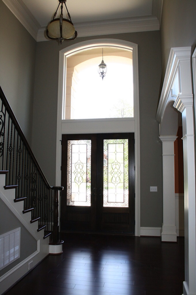 Mid-sized traditional wood straight staircase in Other with painted wood risers and wood railing.