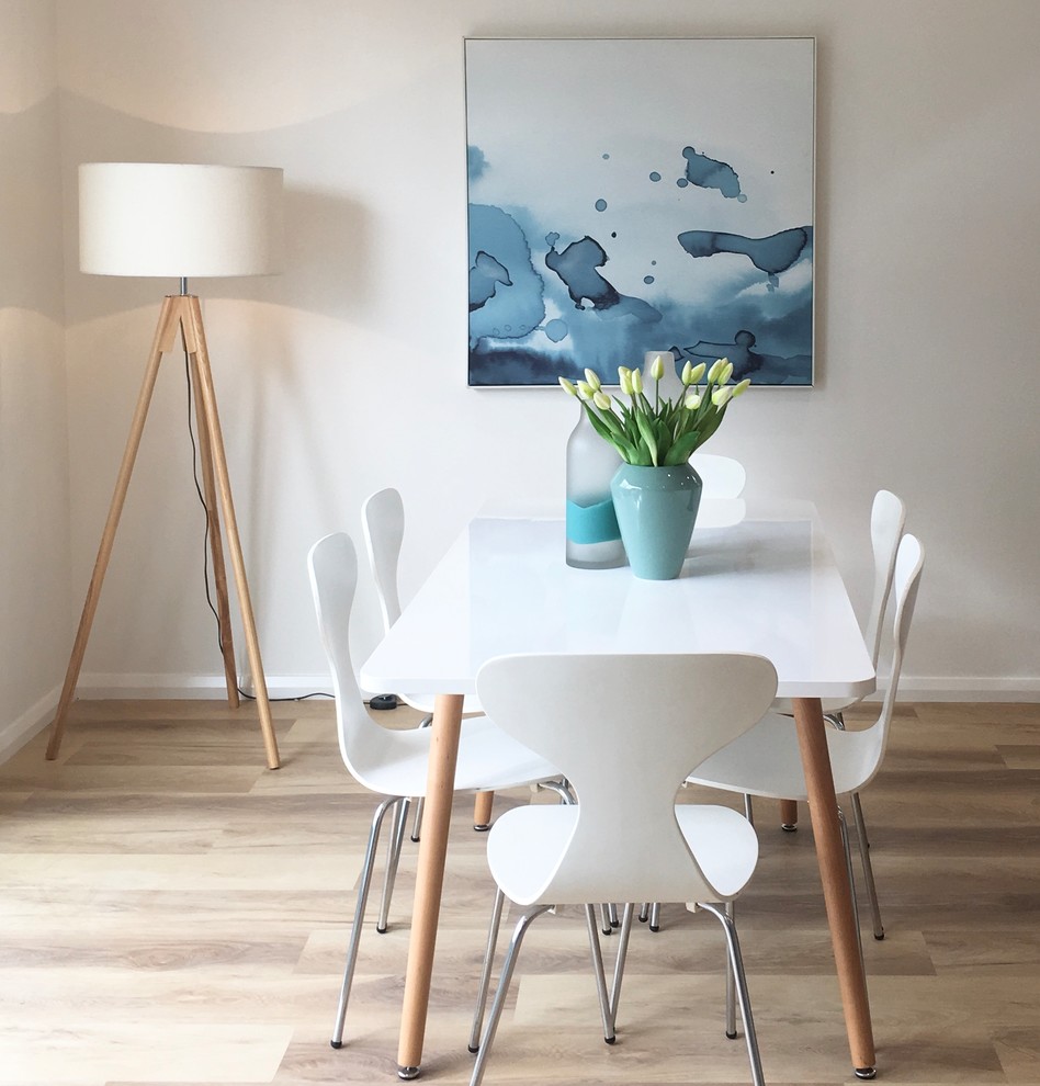 Contemporary dining room in Melbourne with white walls, light hardwood floors and brown floor.