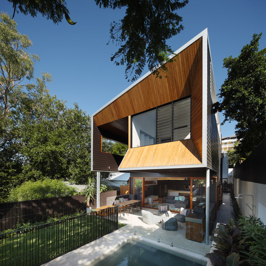 Contemporary two-storey exterior in Brisbane with wood siding.