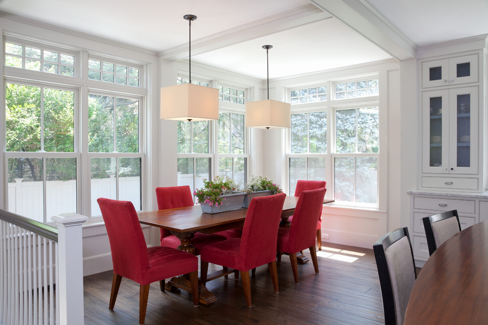 Design ideas for a transitional dining room in Boston with white walls and dark hardwood floors.