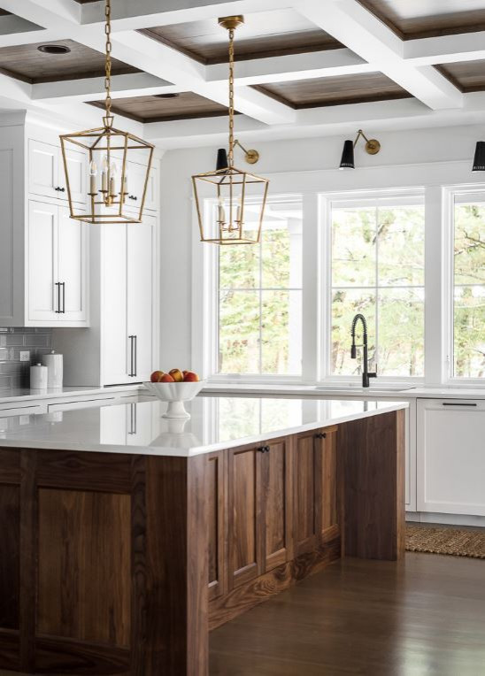 Inspiration for a large country u-shaped kitchen in Chicago with an undermount sink, shaker cabinets, white cabinets, quartz benchtops, grey splashback, subway tile splashback, stainless steel appliances, light hardwood floors, with island, brown floor, white benchtop and coffered.