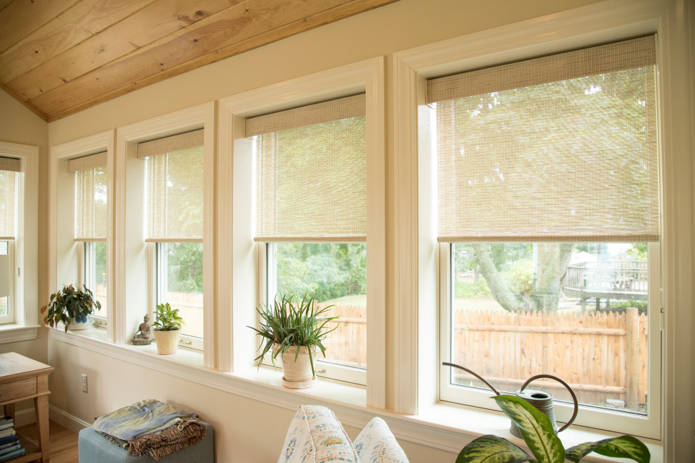 This is an example of a traditional sunroom in Boston with medium hardwood floors.