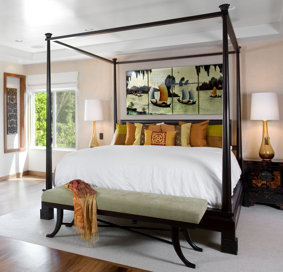 Inspiration for an asian master bedroom in Los Angeles with medium hardwood floors.