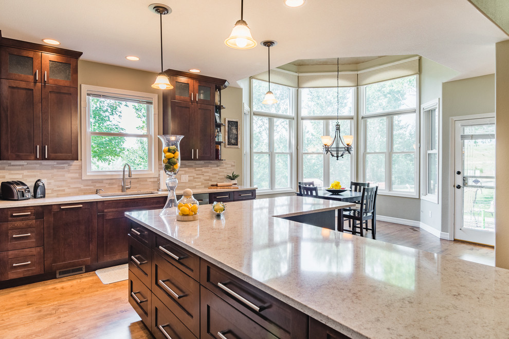 Example of a transitional kitchen design in Denver