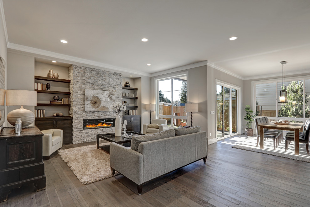 Inspiration for a transitional open concept living room in Orange County with grey walls, dark hardwood floors, a ribbon fireplace and brown floor.