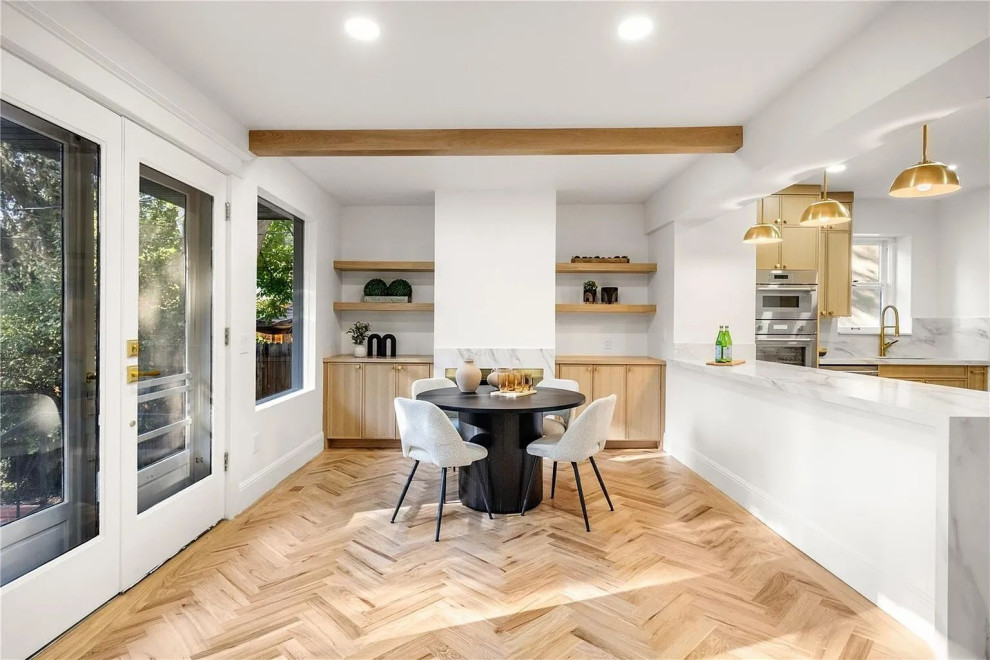 Warm wood tones. Herringbone perfection. 12 foot island. Custom cabinets and bui