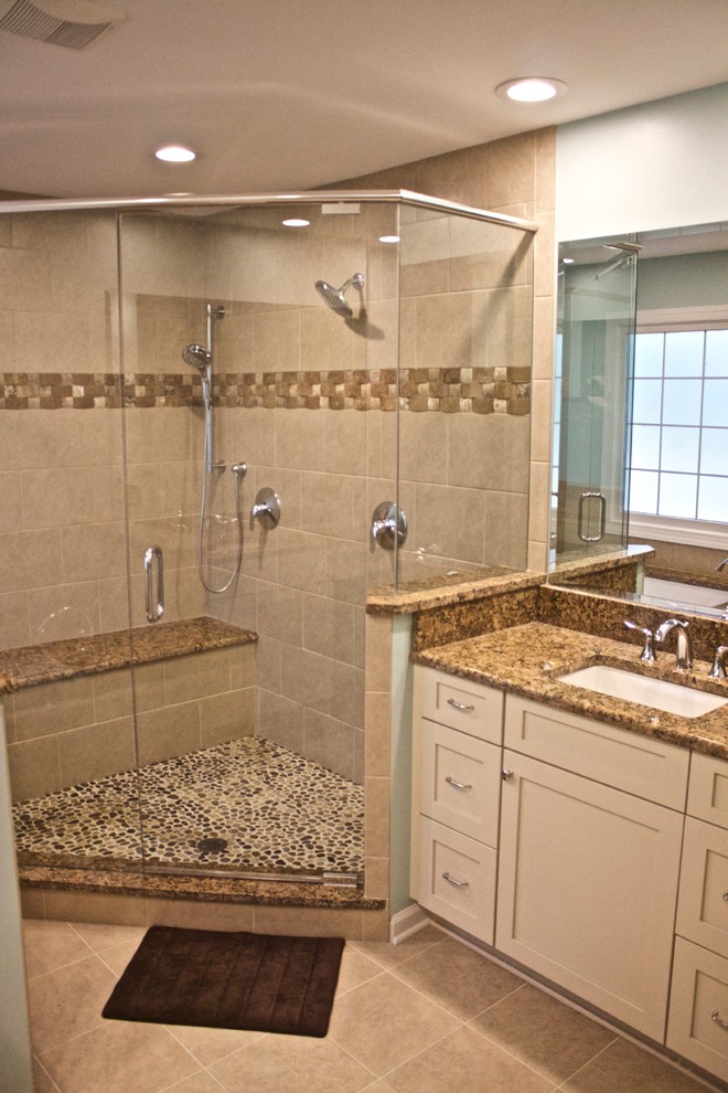 Mid-sized traditional master bathroom in Raleigh with an undermount sink, shaker cabinets, white cabinets, granite benchtops, an undermount tub, a corner shower, a two-piece toilet, beige tile, ceramic tile, blue walls and pebble tile floors.