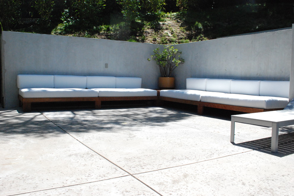 Photo of a contemporary patio in Los Angeles with concrete slab and no cover.