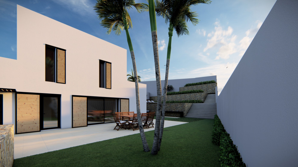 Modelo de acceso privado actual de tamaño medio en patio delantero con muro de contención, exposición parcial al sol y todos los materiales de valla