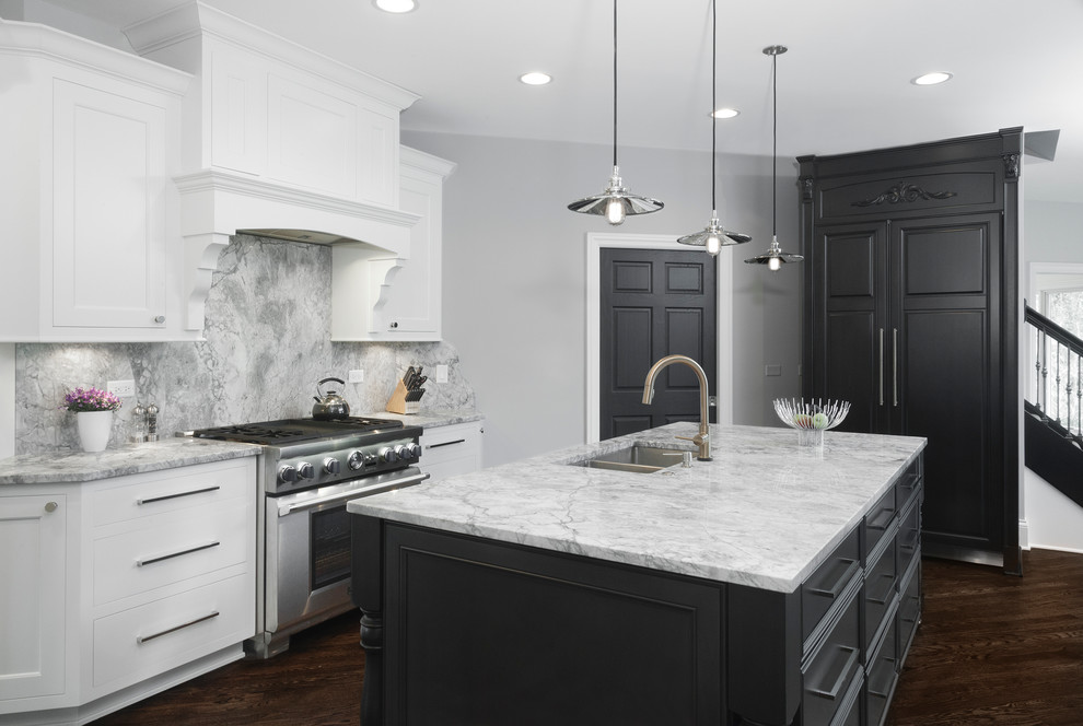 Large transitional galley separate kitchen in Chicago with an undermount sink, flat-panel cabinets, white cabinets, grey splashback, stainless steel appliances, with island, marble benchtops, stone slab splashback and dark hardwood floors.