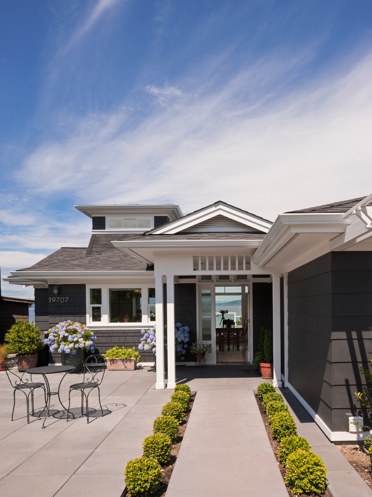 Design ideas for a beach style one-storey grey exterior in Seattle.