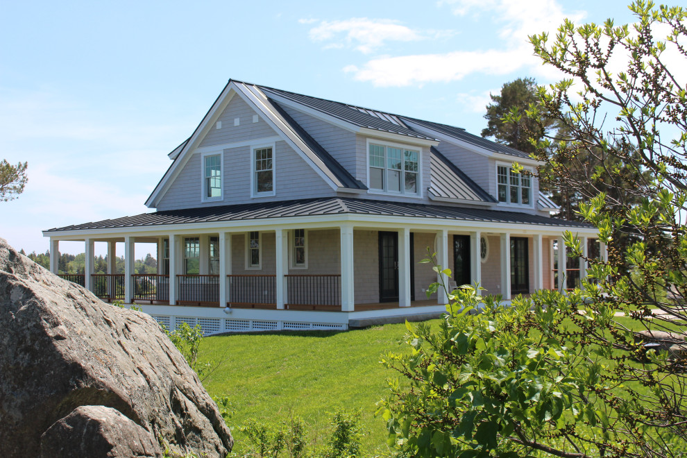 Inspiration for a large coastal gray two-story vinyl exterior home remodel in Portland Maine with a metal roof and a black roof