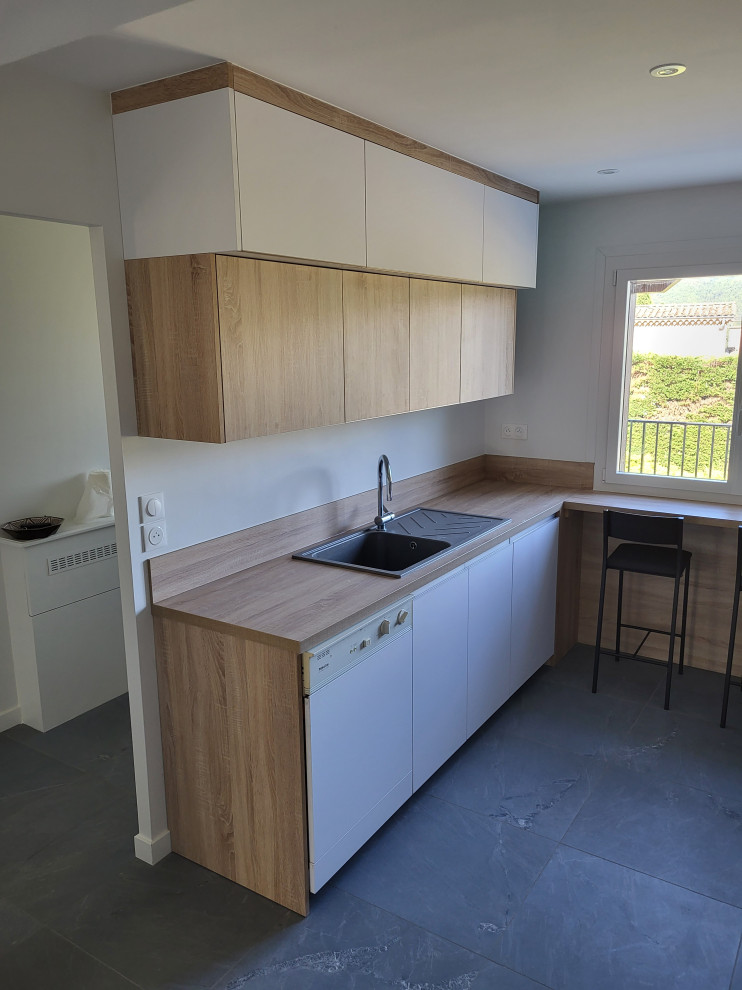 Trendy u-shaped gray floor open concept kitchen photo in Other with a single-bowl sink, laminate countertops and no island