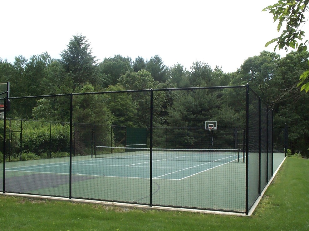 Photo of a large traditional backyard partial sun outdoor sport court in Boston with with outdoor playset and concrete pavers.