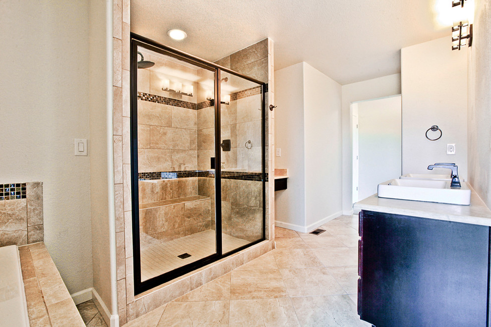 Inspiration for a mid-sized traditional master bathroom in Denver with raised-panel cabinets, dark wood cabinets, an alcove tub, an alcove shower, a two-piece toilet, beige walls, porcelain floors, a trough sink and quartzite benchtops.