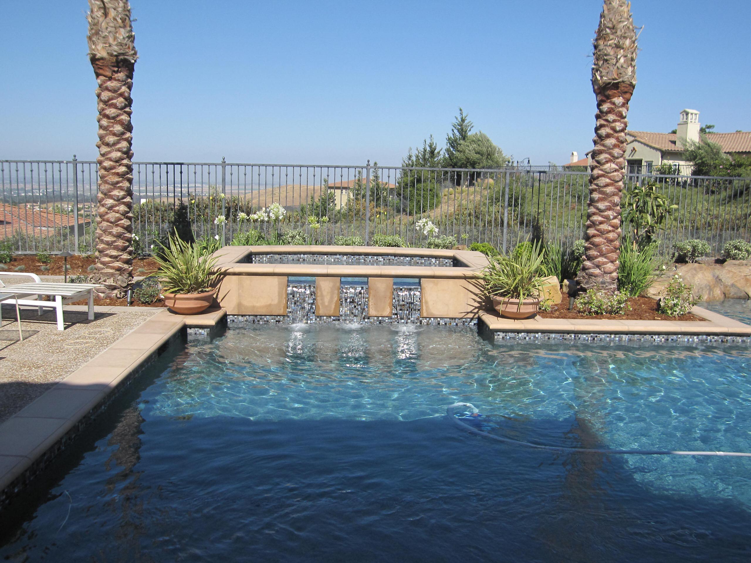 Raised spa with custom glass tile