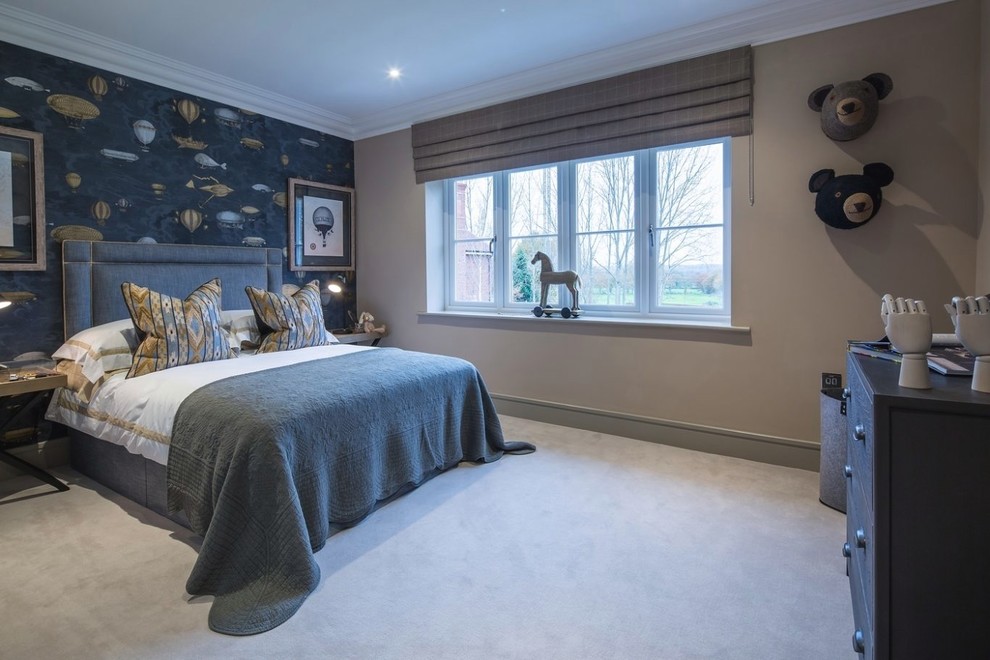 Design ideas for a mid-sized transitional kids' room for boys in Surrey with beige walls, carpet and grey floor.