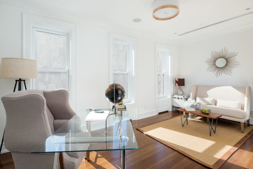 Mid-sized transitional home office in New York with medium hardwood floors and a freestanding desk.