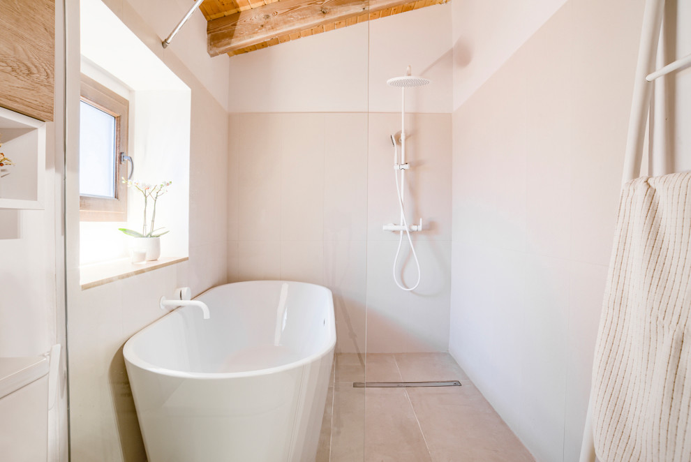Inspiration for a mid-sized scandinavian master bathroom in Barcelona with flat-panel cabinets, light wood cabinets, a freestanding tub, a shower/bathtub combo, a one-piece toilet, beige tile, white walls, porcelain floors, a vessel sink, engineered quartz benchtops, beige floor, white benchtops, a single vanity, a floating vanity and wood.
