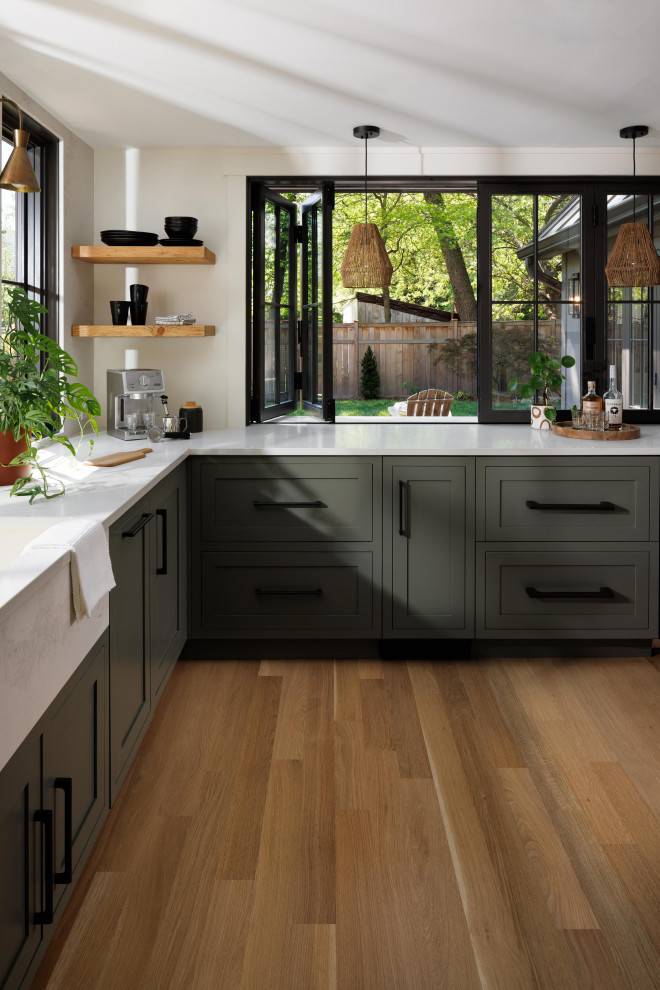 Design ideas for a medium sized traditional l-shaped kitchen/diner in DC Metro with shaker cabinets, green cabinets, stainless steel appliances, medium hardwood flooring, brown floors and white worktops.