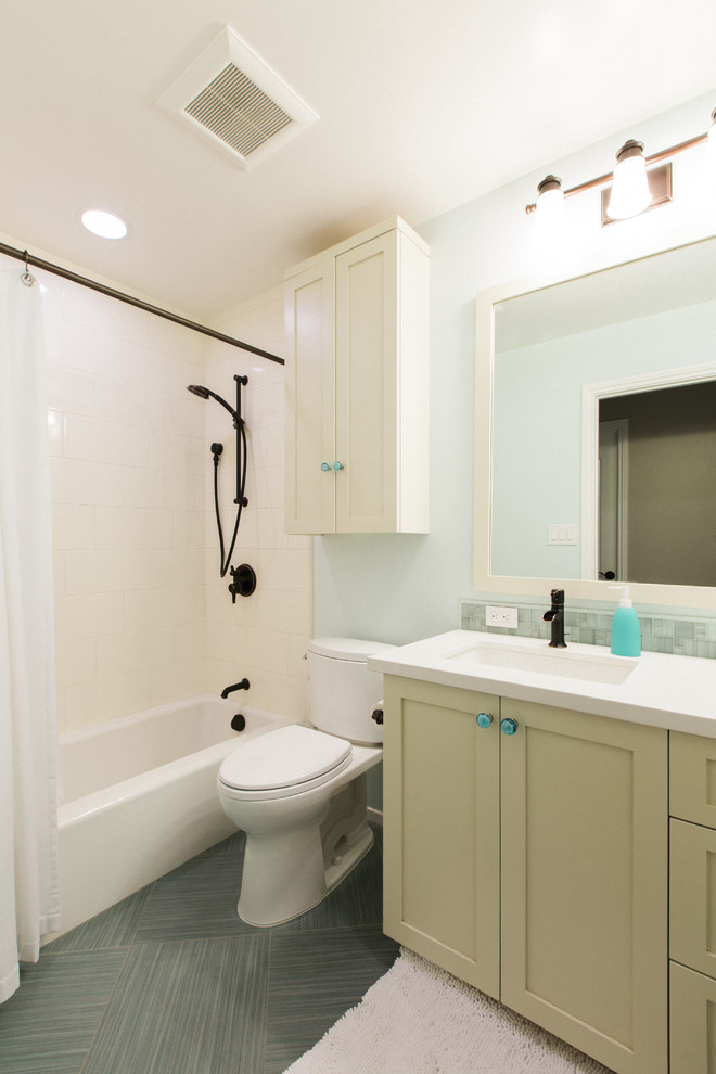 Design ideas for a transitional kids bathroom in San Francisco with shaker cabinets, beige cabinets, engineered quartz benchtops, a drop-in tub, a shower/bathtub combo, glass tile and porcelain floors.