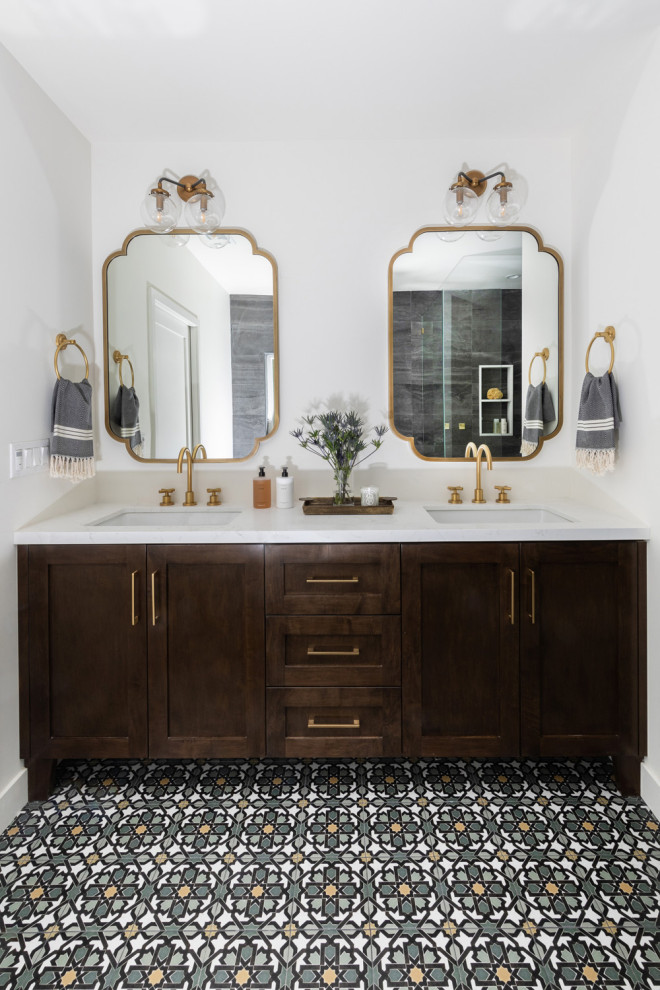 Inspiration for a mid-sized transitional master bathroom in Los Angeles with shaker cabinets, brown cabinets, a freestanding tub, porcelain tile, white walls, porcelain floors, an undermount sink, engineered quartz benchtops, green floor, a hinged shower door, white benchtops, a double vanity and a built-in vanity.