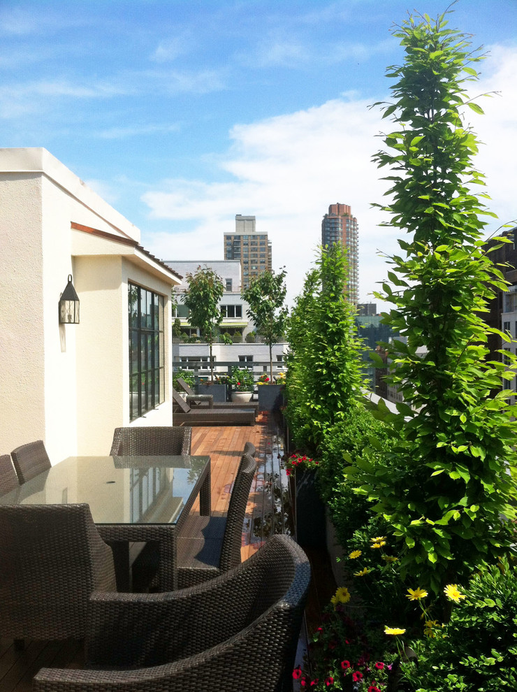 This is an example of a contemporary rooftop deck in New York with a container garden.