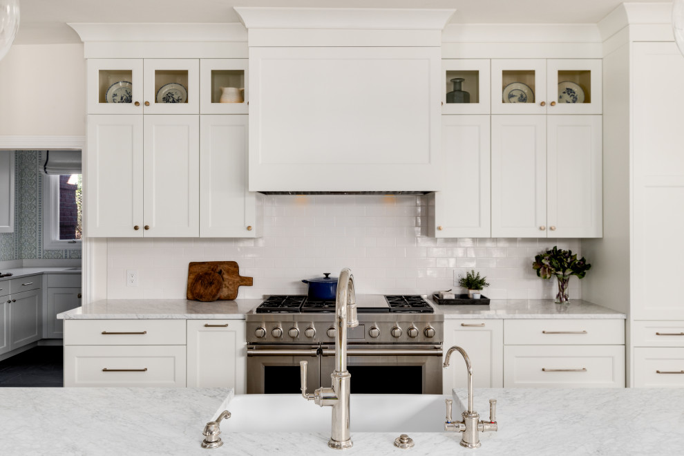 Example of a transitional kitchen design in Denver